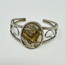 Load image into Gallery viewer, Vintage Navajo Cuff with Flying Gold Eagle on Centerpiece