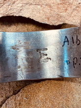 Load image into Gallery viewer, Hallmark signature of Delbert Gordon. Stamped sterling silver